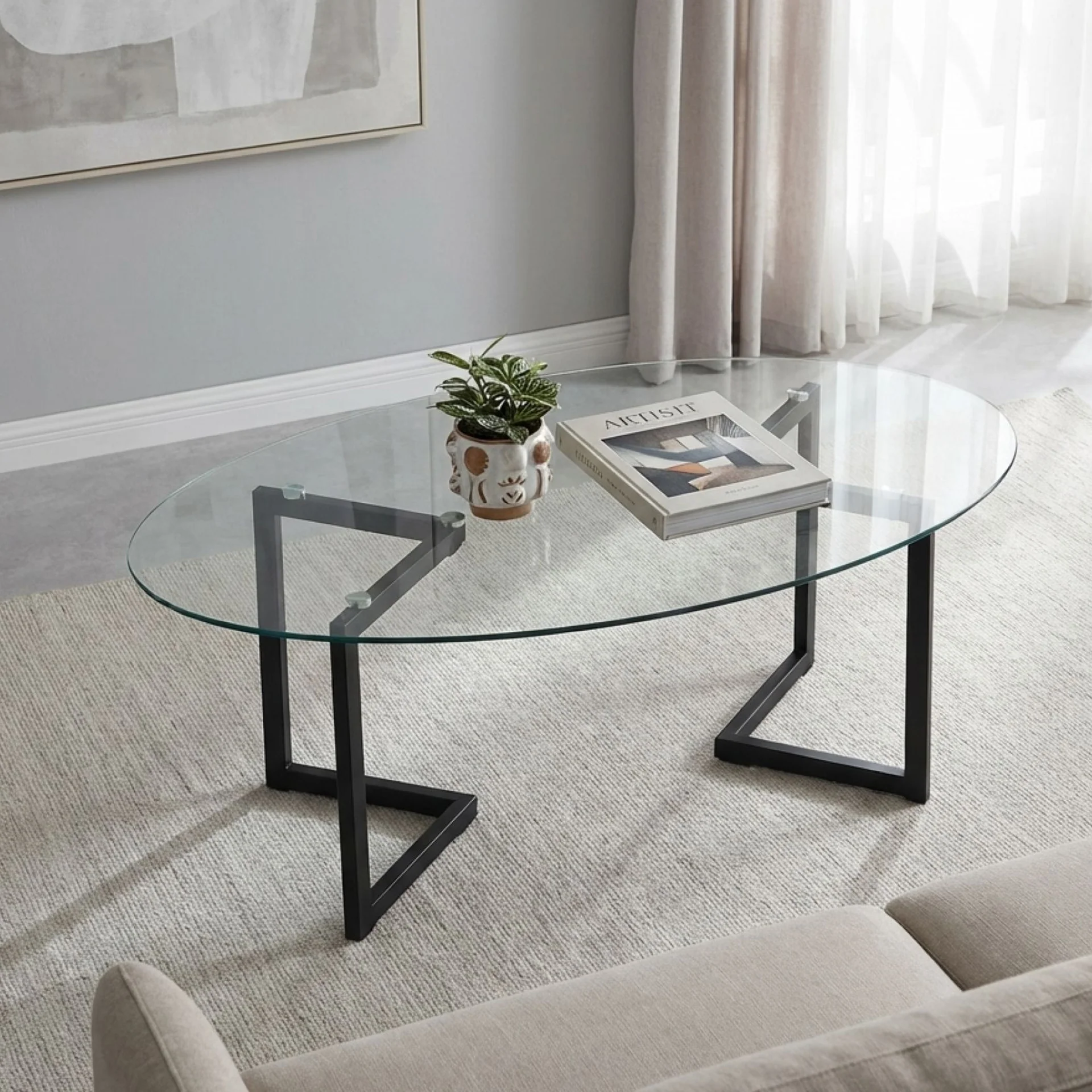 Wynter Tempered Glass Oval Coffee Table 120 x 60cm - Transparent + Black